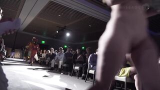 Walking nude throughout the audience