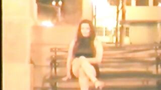 Woman casually pissing on a bench in public