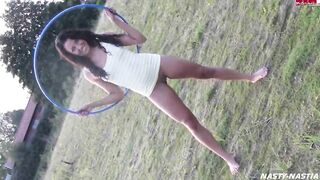 brunette girl peeing while hula hooping - Nonchalant Peeing