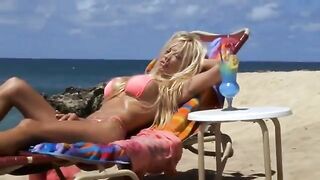 Pamela Anderson sunbathing in a skimpy bikini from 
