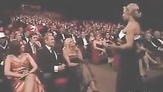 Pamela Anderson and Trish Stratus kiss during an awards show in 2006. - Nostalgia