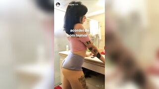 Girl with tattoo's showing a bit of her ass in the bathroom