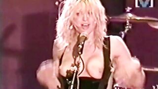 Courtney Love rocking out with her breasts out
