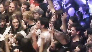 Random guys grope the tits of a girl flashing in the audience of a concert